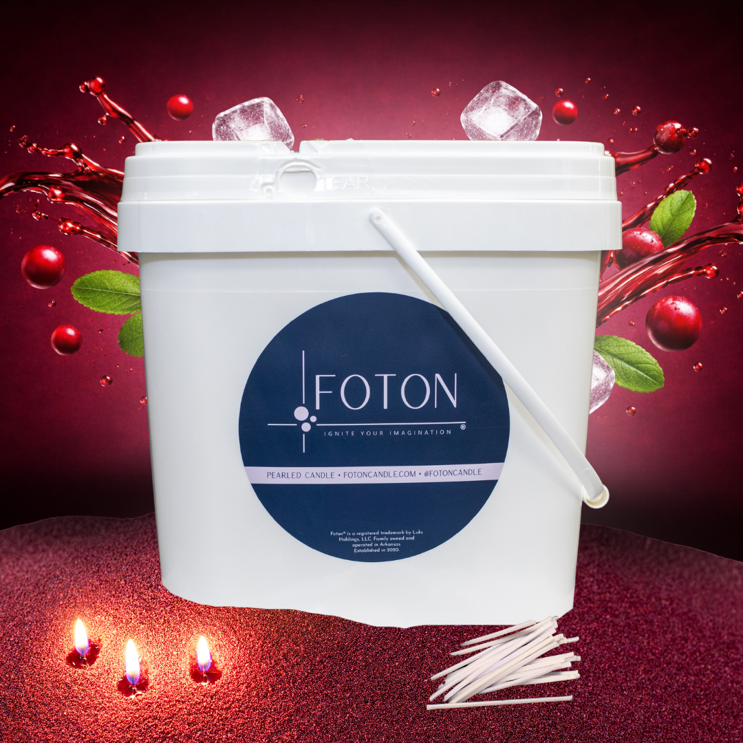 Large white Foton Pearled Candle bucket (XL-Kit) shown against a vivid red cranberry-themed background with splashing juice, cranberries, mint leaves, and ice cubes, with cotton wicks and glowing candle flames in the foreground.