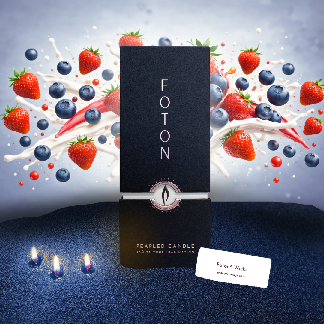 FOTON pearlled candle with a decorative background of strawberries and blueberries.
