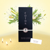 A vibrant, scent-forward product image showcasing the 18oz Foton pearled candle packaging against a fresh, citrus-inspired backdrop. Bursting with botanical elements and dynamic splashes, the scene highlights the fragrance profile while the glowing wicks and textured wax ground the product in warmth and sensory appeal.