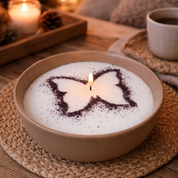 Cozy lifestyle image showcasing a candle bowl with a butterfly stencil design, softly glowing in a warm, inviting setting with natural textures, candlelight, and comforting elements that evoke a relaxing, creative, and personalized home experience.