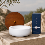 White Luxe Concrete Bowl paired with a matching wooden lid and Foton pearled candle box on a stone surface in an outdoor setting. The image showcases the complete outdoor candle set with a warm, modern aesthetic.