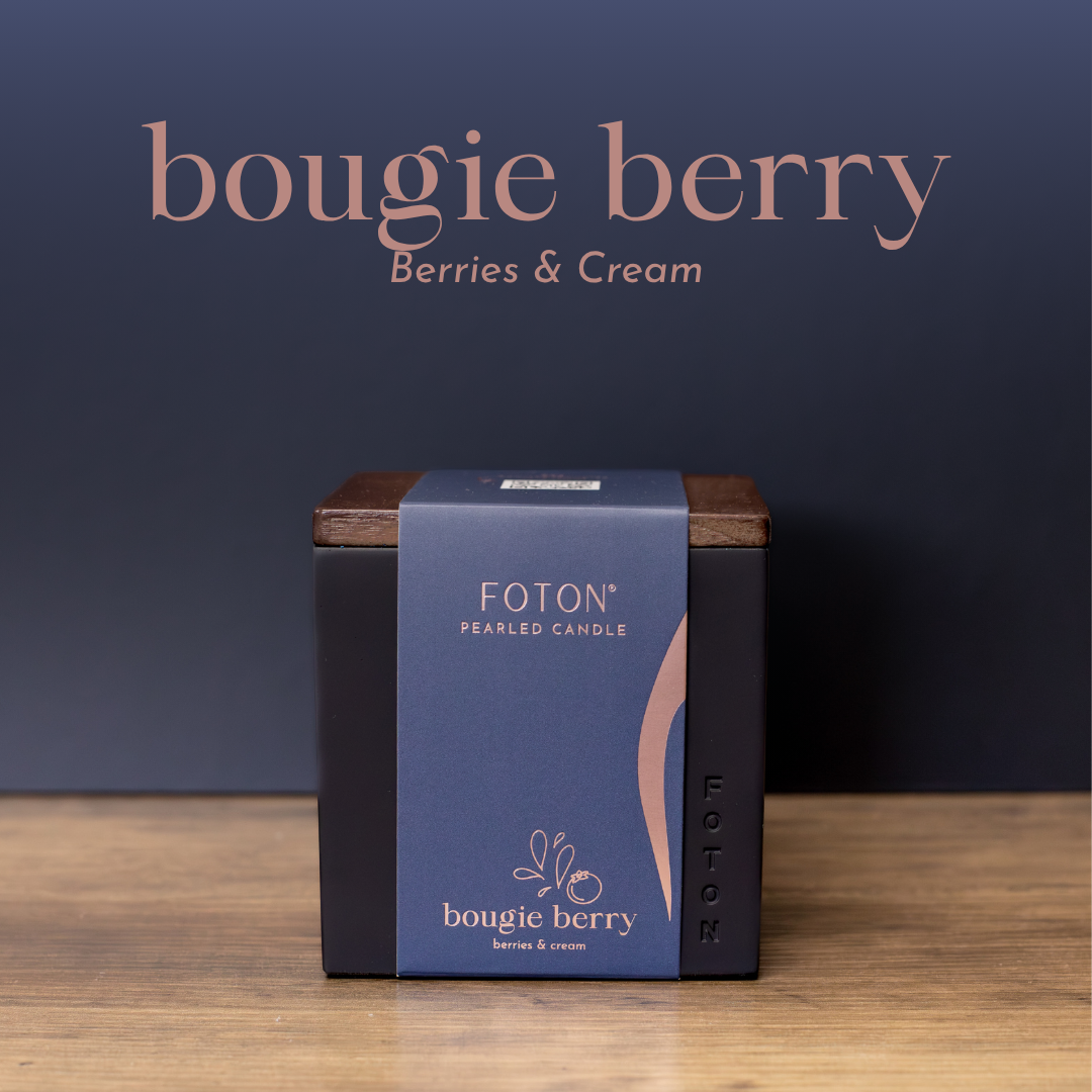 Product image of the Bougie Berry candle in the Le Cube vessel, presented in premium packaging with deep, rich tones to reflect its berries and cream scent profile.