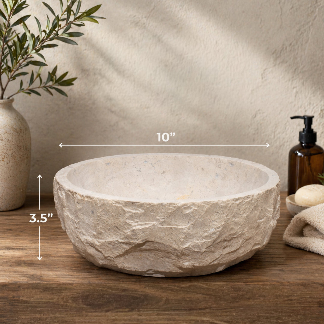Decorative stone bowl with dimensions (10" x 3.5") on a wooden surface, next to a plant and bottles.